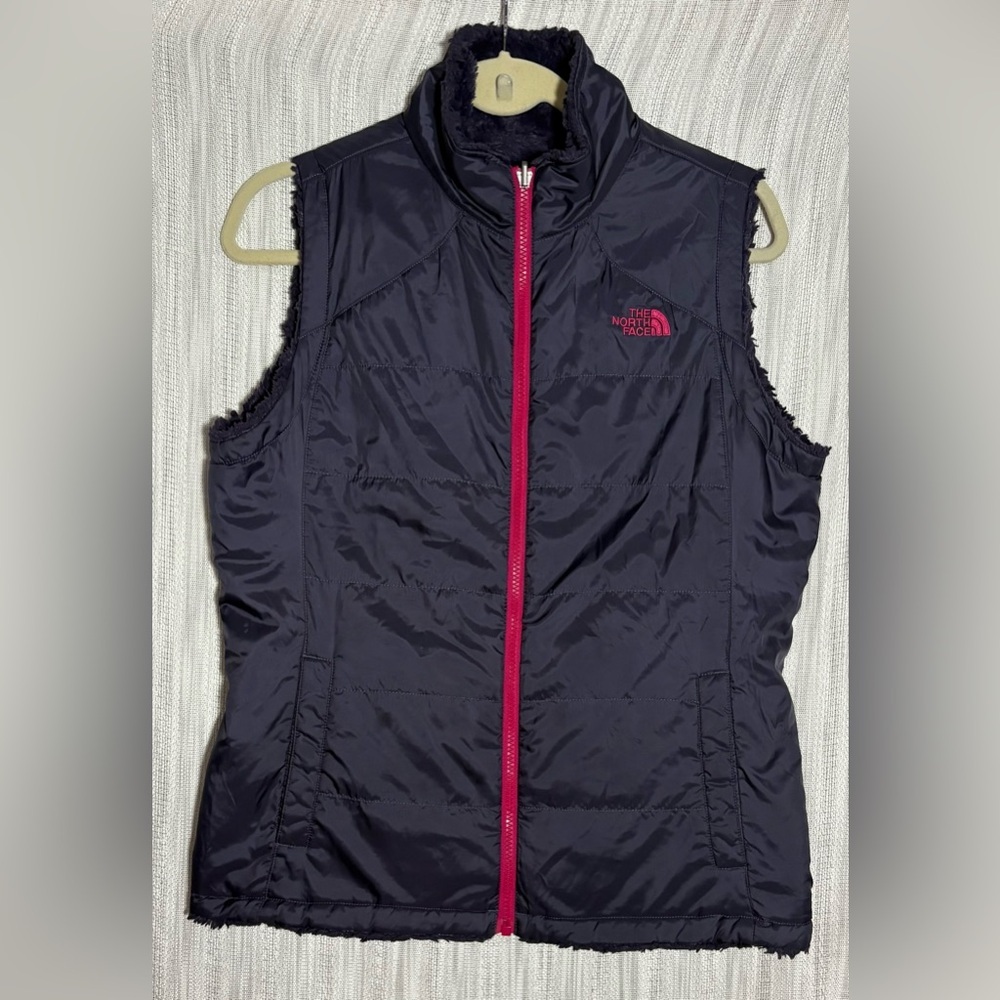The North Face dark purple reversible vest with mossbud lining and pink Accents